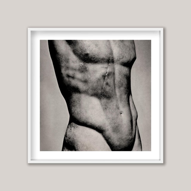 A detailed study of a marble sculpture - in fact, a copy of an Ancient Greek bronze. The athletic male figure is highly...