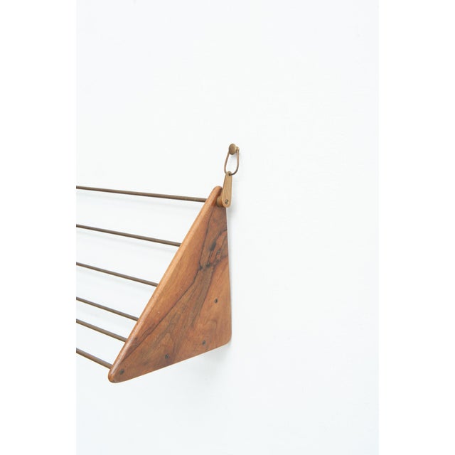Wall-mounted bookcase/book crib by Carl Auböck 1950s Made of solid walnut and brass Width 46.5 cm Height 22.5 cm Depth 21...