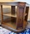 Presenting a gorgeous vintage 1960s–1970s octagonal two-tiered commode or "drum" style side table. This exceptionally...