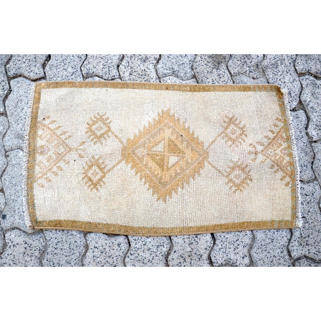 This is a vintage Turkish Oushak rug from the 1960s. The piece was hand-knotted.