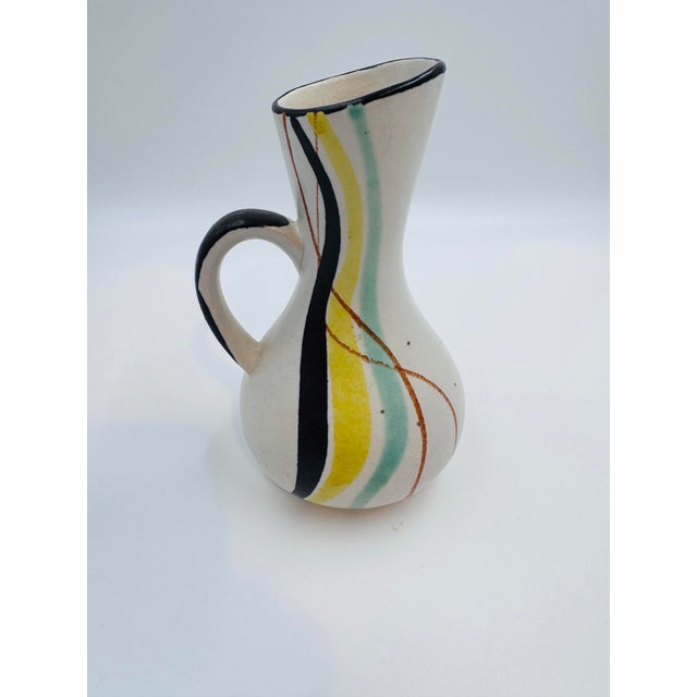 A striking vintage Bay Keramik handled pitcher vase from West Germany, dating to the late 1950s to early 1960s. This...