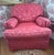 Beautifully upholstered club chair in a deep coral damask. Rolled arms with nicely pleated end detail. (arm covers...