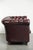 This timeless Chesterfield 2.5-seater sofa is made of cowhide leather and has an amazing dark red color. This characterful...
