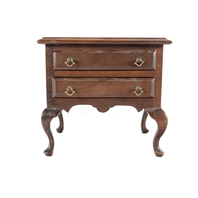 A small vintage salesman sample of a low Queen Anne-style side table with two drawers, brass bail pulls, scalloped apron,...