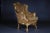 Solid beechwood, carved and gold frame. Semi-circular ascending backrest framing with Rocaillon crowning. Passive, carved...