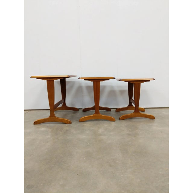 Set of authentic vintage mid century modern teak nesting tables / side tables. This set is in excellent condition overall...