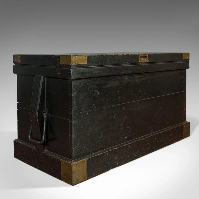 This is an antique master shipwright's chest. An English, ebonized mahogany tool trunk with ornate interior, dating to the...