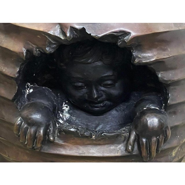 A bronze-colored side pedestal or plant table A bronze-colored side table that can be used as a plant table. This bronze-...