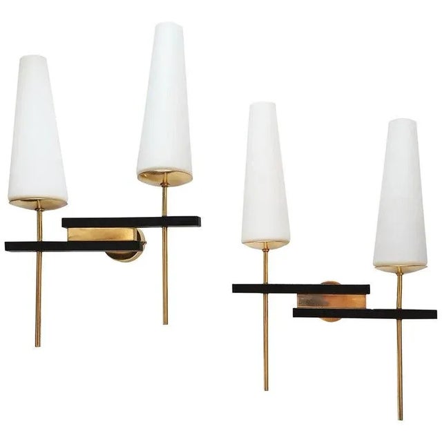 Superb pair of Arlus sconces in Brass, Steel and blown Opaline Glass. US rewired and in working condition each Sconce...