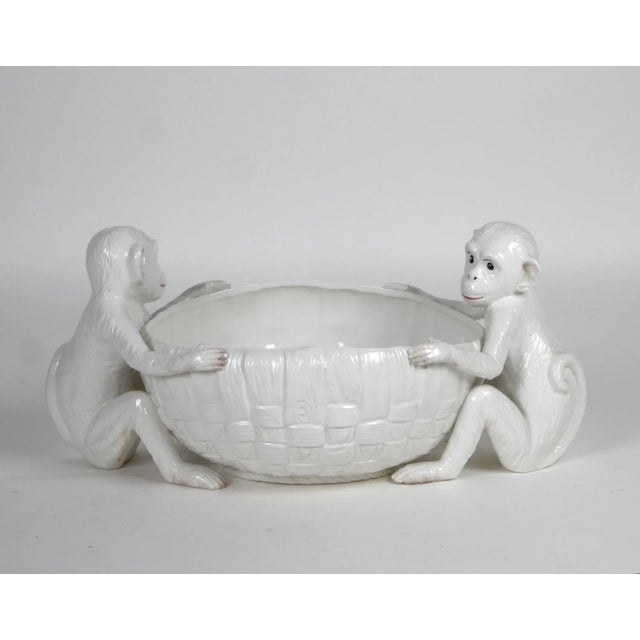 Vintage white glazed ceramic fruit bowl with monkey handles. Adorable piece that would hold 20 bananas or other assorted...