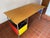 The innovative Eames Desk (1952) includes a file drawer on the right. This original is an authentic, fully licensed...