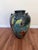 Statement-scale 20th century ceramic urn / floor vase featuring a richly hand-painted tropical bird motif on a deep...