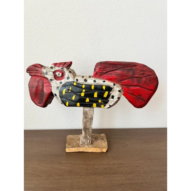 We're proud to present this large vintage hand carved polychromed wooden rooster folk art statue with beautifully aged...