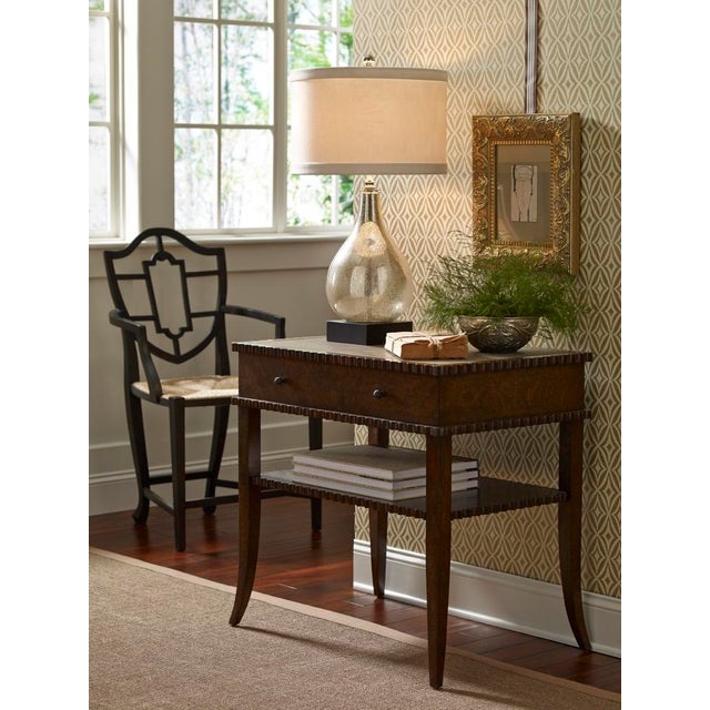 Mercury glass lamp features an antiqued glass with a gracefully curved teardrop design on a black wooden mounting. The off...