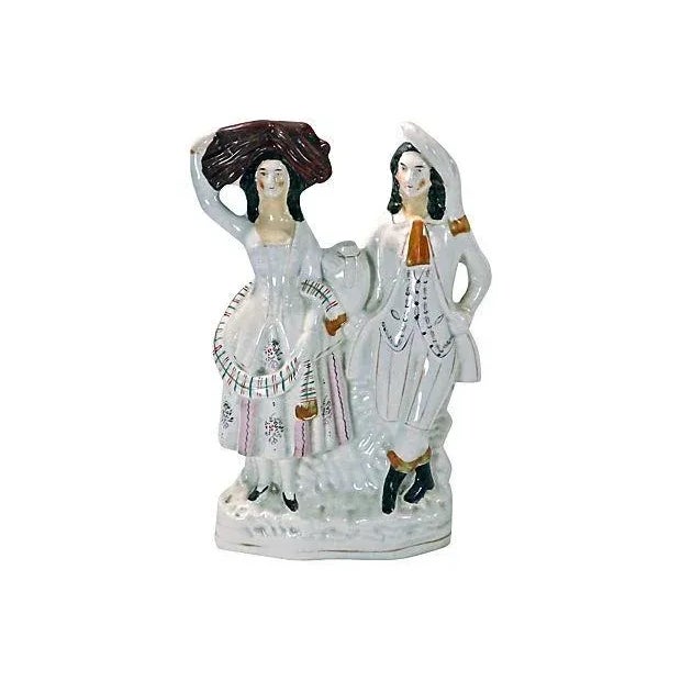 Antique English Staffordshire couple figurine. No maker's mark.