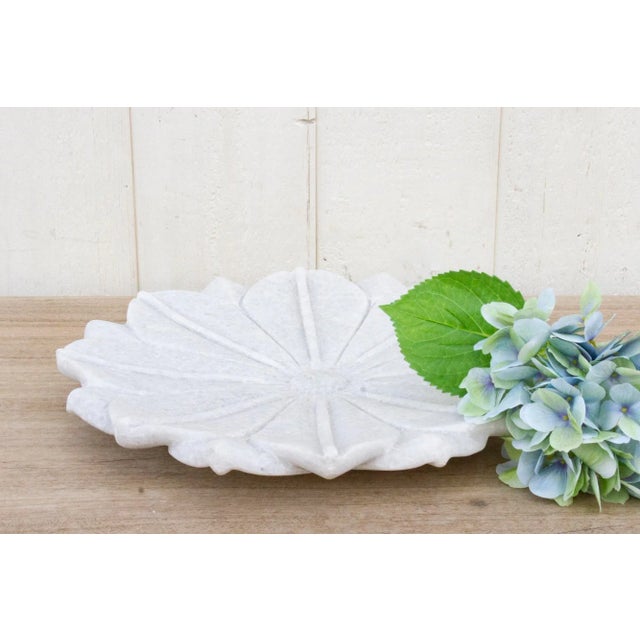 Beautiful large marble plate with carved open lotus flower motif and a polished finish. This Indian plate is the perfect...