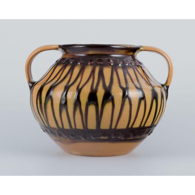 Kähler, Denmark. Ceramic vase. Classic shape with two handles. Cow horn technique. Handcrafted. Glaze in shades of yellow...