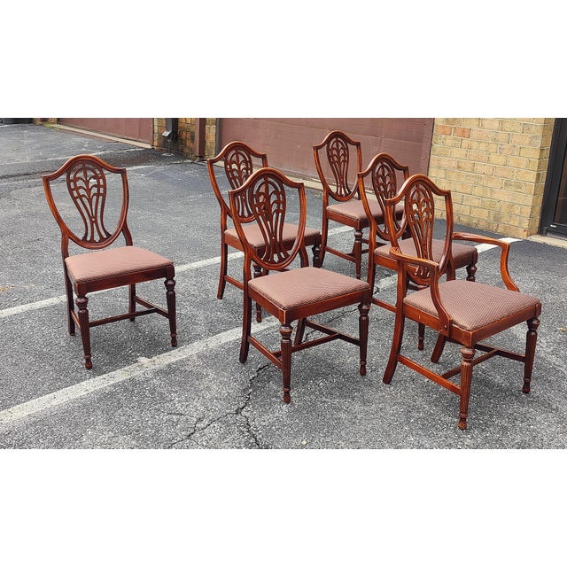 This is a gorgeous full set of six vintage Duncan Phyfe or Hepplewhite style Shield Back dining chairs (no makers mark)....