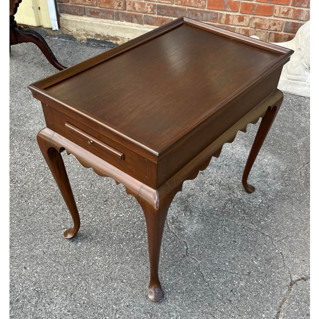 Vintage, high quality mahogany tea table. Possibly custom made. Features a dished top, two extendable candle holders on...