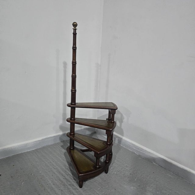 A good set of of mahogany library steps, leather steps, turned post with brass ball top. 46" high 21" steps height 17"...
