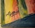 An abstract cubist-style painting depicting a bull’s head rendered in fragmented, faceted planes of color, warm reds,...