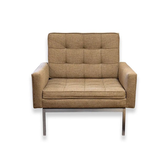 A striking pair of mid-century modern armchairs designed by Florence Knoll for Knoll Associates. These iconic lounge...