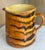 Large French Jaspe glazed ceramic country pitcher in a swirl pattern of black, yellow & green over a burnt orange...