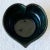 Amazing hand made pottery bowl by Bennington Pottery in Vermont. Features a heart shape with a black gloss finish.