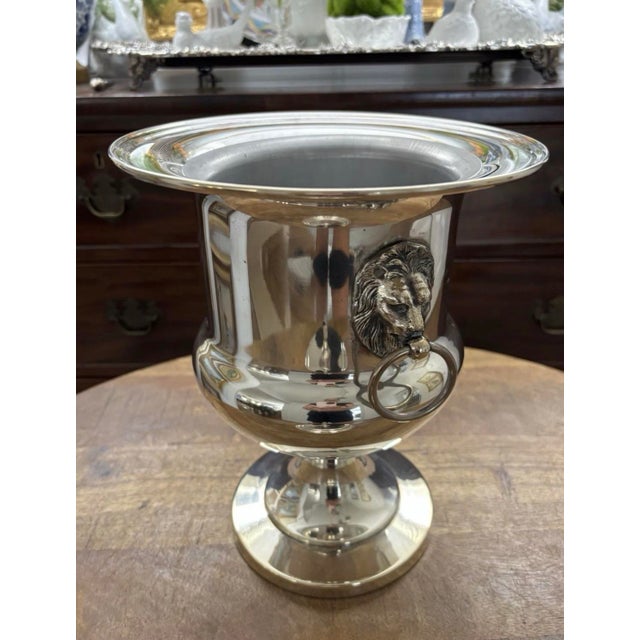 Spectacular vintage silver plated ice bucket with acorn finial lid. Fabulous lionhead door knocker handles and a beautiful...