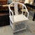 Distressed white horseshoe Asian style chair. Classic curved back Asian chair with a cane seat that has been whitewashed...