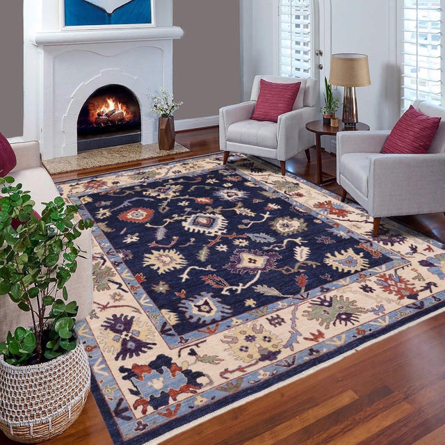 Enhance the ambiance of your home with this magnificent Persian-influenced Turkish hand-knotted rug made by skilled...