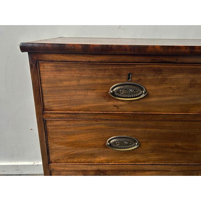 An English late 18th century mahogany 2 over 3 chest of drawers. The five drawers are of dovetail construction. Each has...