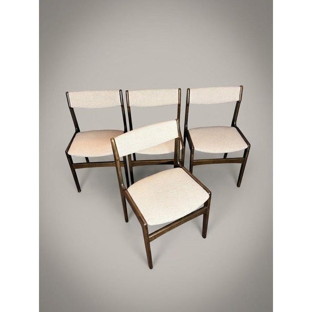 Elevate your dining space with this exceptional set of four mid-century dining chairs, manufactured in Denmark during the...