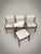 Elevate your dining space with this exceptional set of four mid-century dining chairs, manufactured in Denmark during the...
