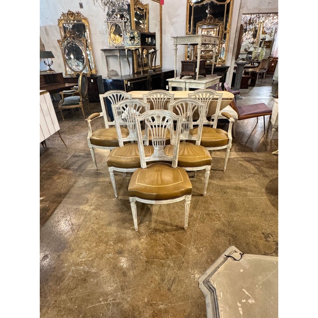 This set of 6 French Louis XVI dining chairs is perfect for those looking to add a touch of class and sophistication to...