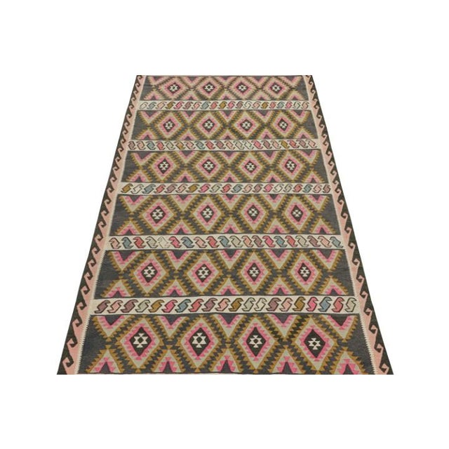 This vintage 6x11 Persian Kilim is a tribal rug from Meshkin—a small northwestern village known for its fabulous works....