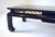 A mid 20th century black lacquered Ming style coffee table embellished with pierced brass fretwork just beneath the top...