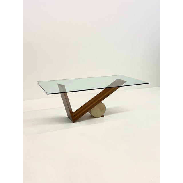 The Valentino dining table, designed by Emanuele Zenere for Cattelan in the 1990s, combines a walnut base with a...