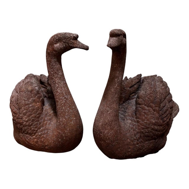 A lovely pair of vintage swan statues, perfect for adding timeless elegance and character to your indoor or outdoor space....