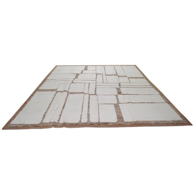 Hand-knotted with care using traditional rug making techniques, this wool rug blends timeless craftsmanship with a modern...