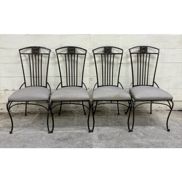 This is a beautiful set of four vintage Hooker Furniture wrought iron sculptural patio chairs or dining chairs. Solid and...