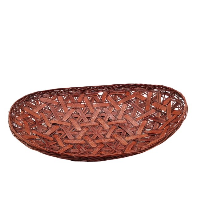 Handwoven Japanese bamboo ikebana flower basket made with split and naturally stained bamboo. These are traditionally used...
