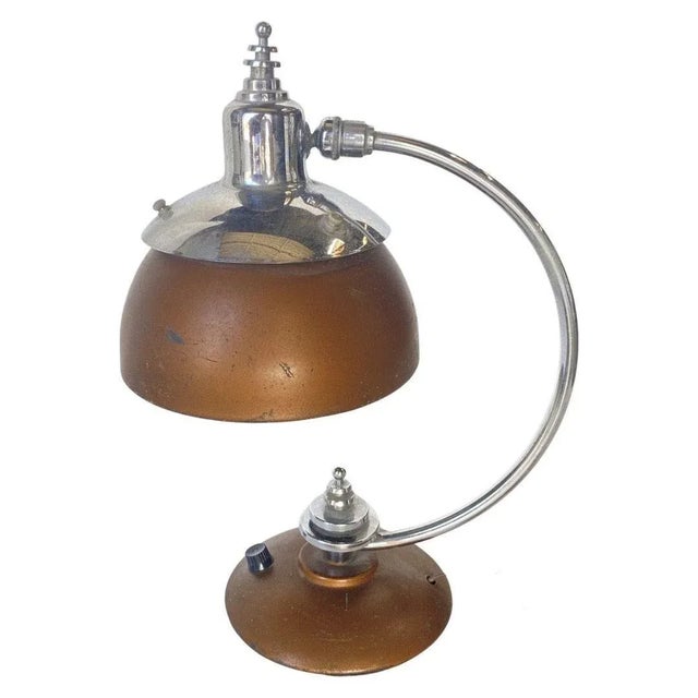 Machine Age, Art Deco Copper, and Chrome Desk Lamp from 1932. The lamp features a modernist bell-shaped copper lamp shade...