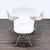 This Eames Dining Set includes an elegant white oval table with a sturdy pedestal base and four matching white chairs. The...