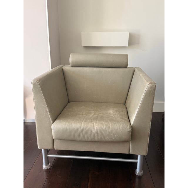 Single Ettore Sottsass East Side Armchair for Knoll, circa 1980, Italy. Grey leather and metal base with leather wear...
