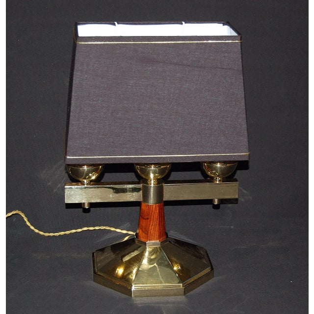 Spectacular Art Deco 1930 period lamp in solid bronze and wood. Octagonal brass base from which rises an octagonal shaft...