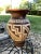 Behold the rustic charm of this vintage, unsigned pottery piece adorned with a captivating brown and white Southwestern...