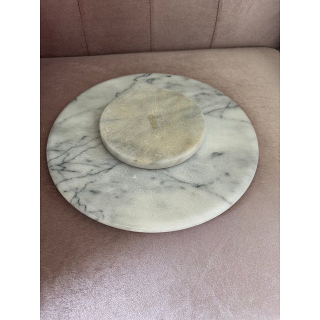 Vintage natural white marble serving tray with unique gray veining. The tray rotates smoothly on a solid marble base....