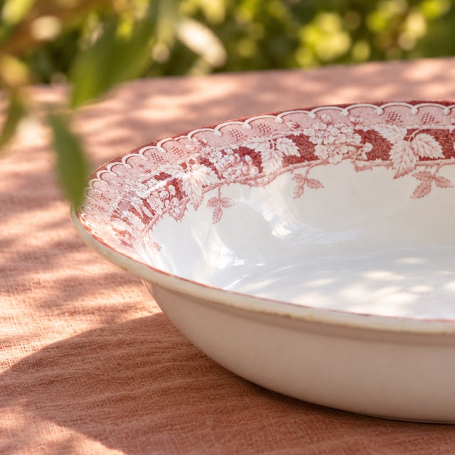 Deep dish - antique pink ironstone salad bowl, stamped St Amand “Mûrier” collection. The rim is richly decorated with a...