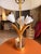 This contemporary glam table lamp features a sculptural gold porcelain flower accented with crisp white detailing,...